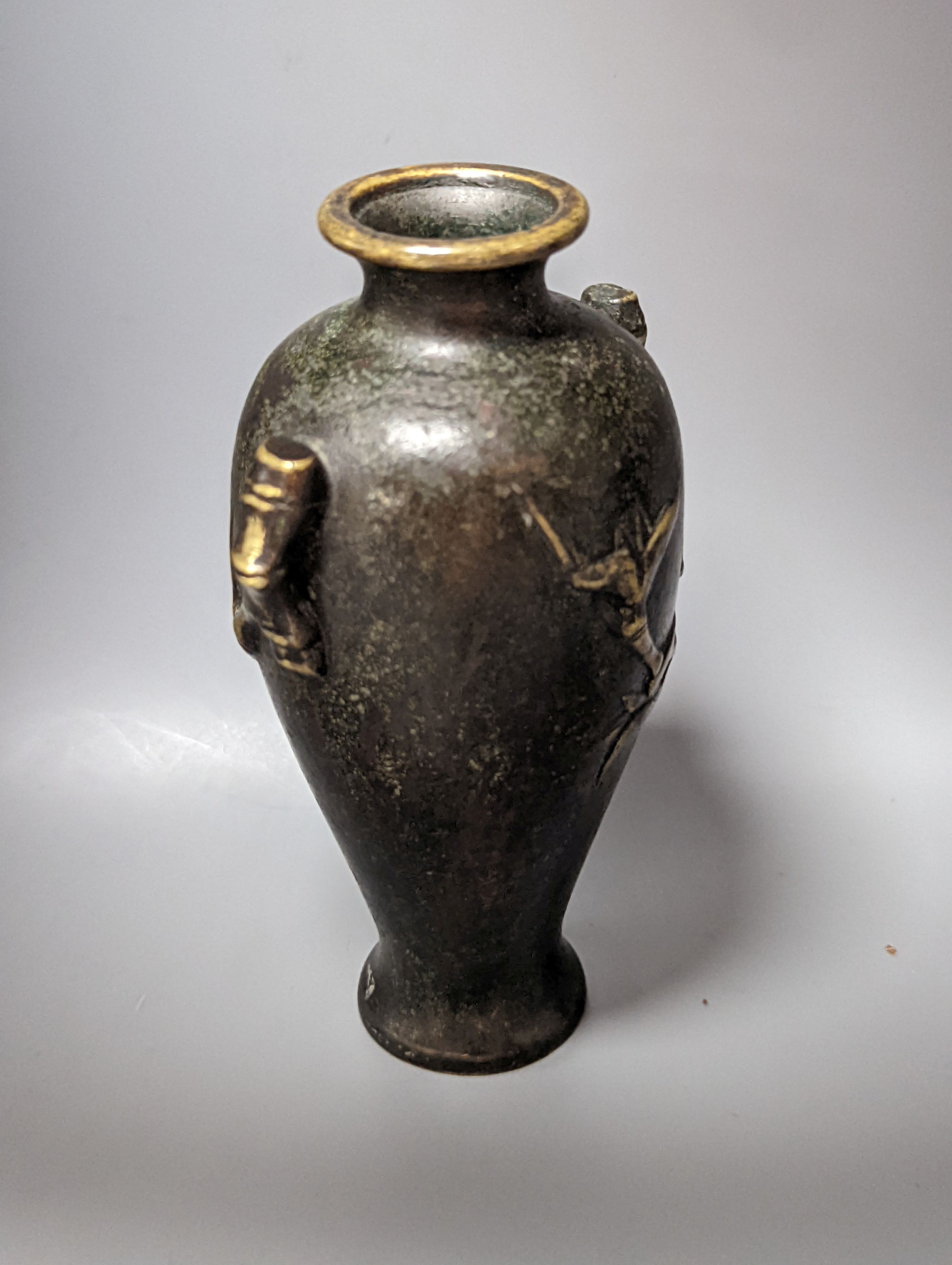 A Chinese bronze vase, 12cm., and an Islamic pierced brass lamp